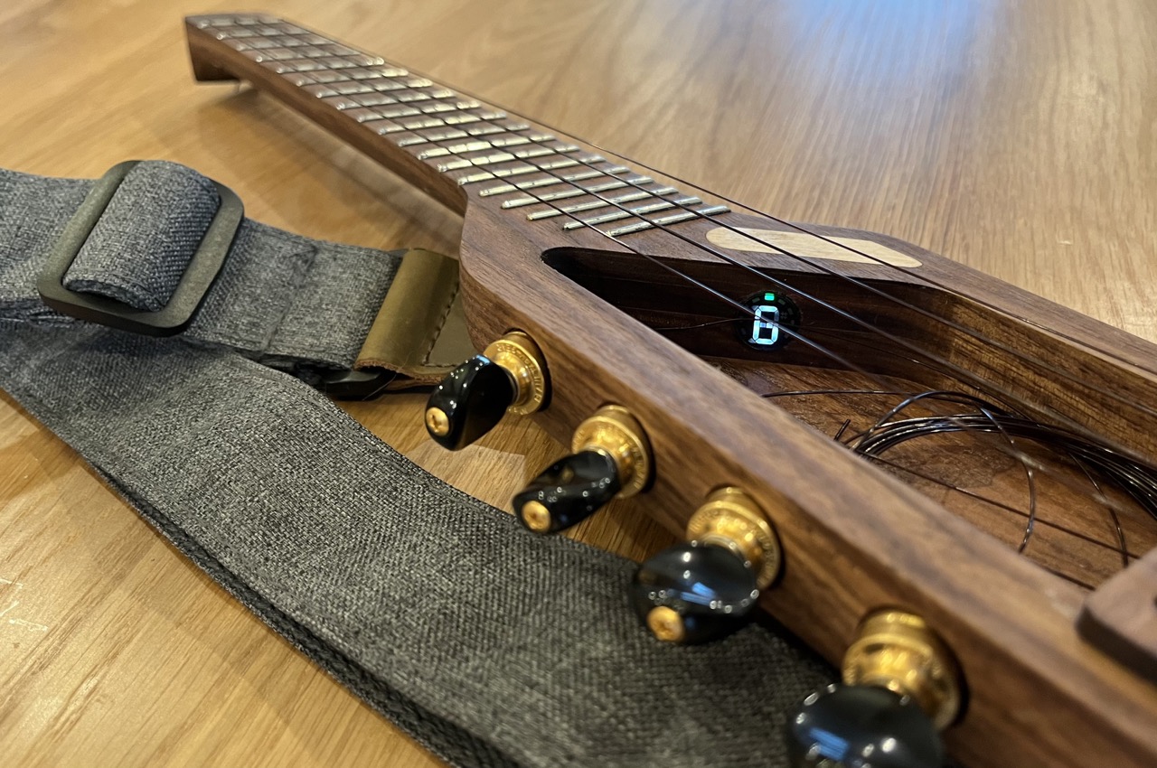 Detail of the tuner visible looking down through the strings